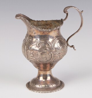 A George III silver baluster cream jug, the repousse decoration depicting riverscapes and monogram, London 1811, 11cm, 110 grams 