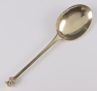 A George I silver gilt seal end table spoon with thistle finial engraved 1767 and rat tail bowl, maker Richard Scarlett, London 1725, 18cm, 48 grams 