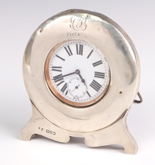 An Edwardian silver pocket watch case with engraved monogram and dated 1905, Chester 1902 12cm with a chromium Goliath pocket watch 65mm 