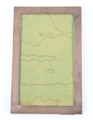 An Edwardian rectangular silver photograph frame with engraved monogram 21cm x 13cm, Birmingham 1907 