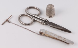 A silver tie pin London 2000, thimble and mounted scissors, 14 grams