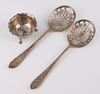 A pair of silver sifter spoons with floral decoration London 1912, a silver mustard and a salt spoon, 164 grams 