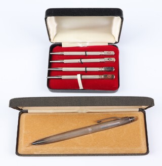 A set of 4 Sterling silver and enamelled bridge pencils 9cm, together with a silver ballpoint pen, both boxed