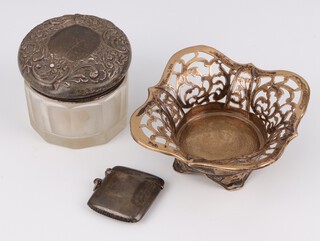 An Edwardian pierced silver dish Birmingham 1910, a vesta and a lidded toilet jar (holed), 82 grams 