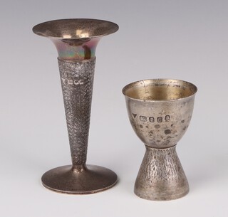 A silver hammer pattern egg cup London 1977, 7cm, a ditto vase London 1978 10cm, 136 grams 