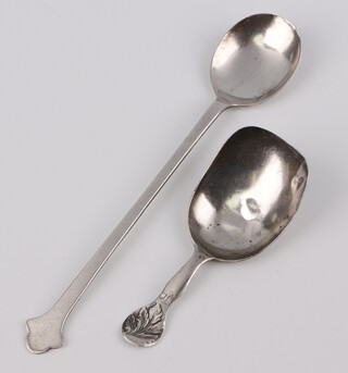 A Victorian Scottish silver caddy spoon with leaf handle Edinburgh 1846 and an Arts and Crafts style silver spoon Sheffield 1921, 28 grams 