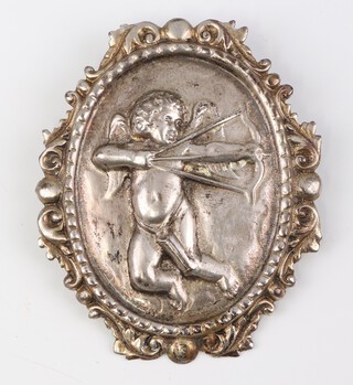 A cast silver brooch decorated with a cherub 7cm, 26 grams 
