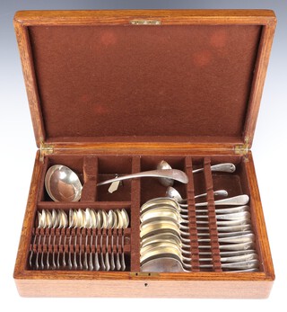 A canteen of Old English pattern silver cutlery comprising 18 tea spoons, 12 table spoons, a sifter spoon, a small ladle, a large ladle, all Sheffield 1926, with armorial, maker Charles Westwood and Sons, 1524 grams, contained in an oak canteen with silver mounted presentation inscription  