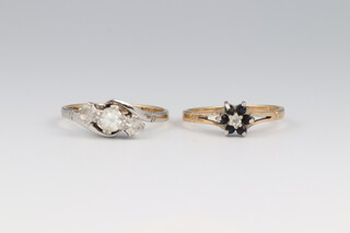 A 9ct yellow gold paste 3 stone ring, size L and a ditto sapphire and diamond cluster ring size N, 3.2 grams 