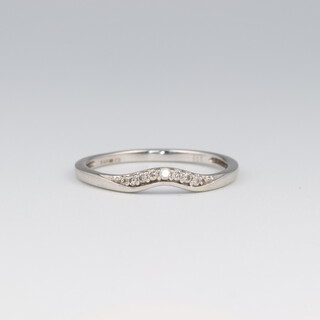 A 9ct white gold diamond set half eternity ring, ensuite to lot 28, diamonds 0.01ct, size O, 1.3 grams 