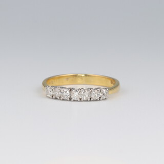 An 18ct yellow gold diamond set half eternity ring, 0.2ct, size N, 2.4 grams 