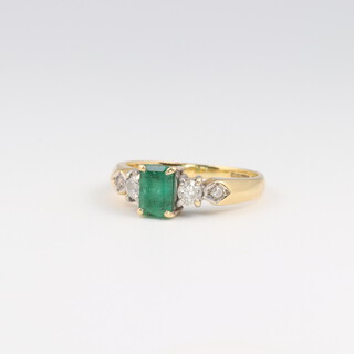 An 18ct yellow gold emerald and diamond ring the rectangular cut emerald 0.5ct, the 4 diamonds 0.03ct, size J, 3.3 grams 