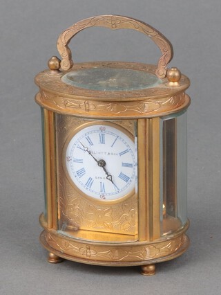 Elliot and Sons, a 20th Century carriage timepiece with 3cm circular enamelled dial, Roman numerals, contained in a gilt metal case on bun feet 9cm h x 6cm w x 5.5cm d 