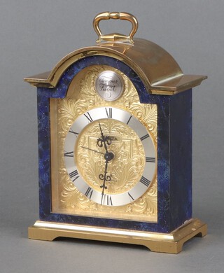 Swiza, an 8 day Swiss mantel alarm clock with 8cm gilt arched dial, silvered chapter ring, contained in a gilt metal and lapis lazuli effect case 13cm x 11cm x 6cm 