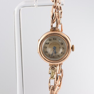 A lady's 9ct yellow gold wristwatch, the dial inscribed James Walker London, contained in a 25mm case on an expanding 9ct yellow gold bracelet, gross weight 17.7 grams 