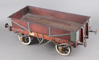 A 1920's working model of an open truck with iron shod wheels, sprung buffers 24cm h x 68cm w x 28cm d with plaque to each side "Braun & Co. Inventors' Engineers' & Model Makers, 236 Pentonville Road, Kings Cross, London"