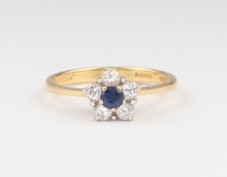 An 18ct yellow gold sapphire and diamond cluster ring the centre sapphire 0.10ct, the 5 brilliant cut diamonds 0.10ct, size N, 2.4 grams 