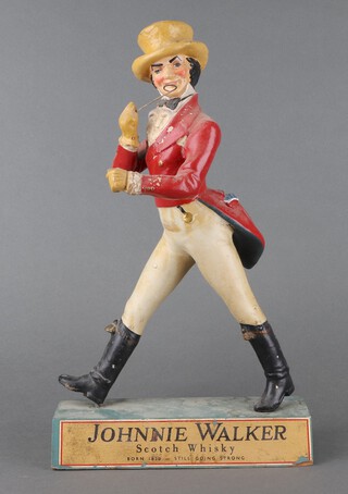 Johnnie Walker, a composition bar ornament in the form of a walking Johnnie Walker 41cm h x 33cm w x 7cm d 