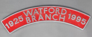 A crescent shaped enamelled and red polished alloy commemorative engine plate sign, marked Watford Branch 1925-1995 108cm x 20cm 