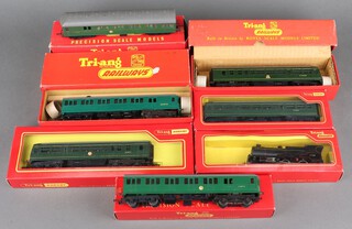 A Triang OO gauge R157 diesel power car, an R156 Suburban motor coach, an R225 Suburban motor coach, an R157 diesel rail car with seats, an R158 diesel trailer car boxed, a British Railways carriage (incorrect box) and a 41168 locomotive in black livery (no tender and incorrect box) 