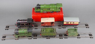 A Hornby O gauge locomotive C3 Flying Scotsman boxed, complete with tender unboxed (in running order, paint loss around the winding key and in places), ditto O gauge locomotive and tender Type 105 (running order light paint loss), a railway brake van, an O gauge Type 40 tank engine in British Railways black livery (running order light paint loss in places), O gauge guard van and 4 associated winding keys 