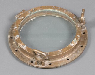 A circular polished bronze ships porthole 42cm with detached mirrored back 