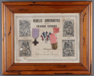 A French First World War combat cross together a commemorative medal mounted in a frame with certificate 42cm x 53cm 