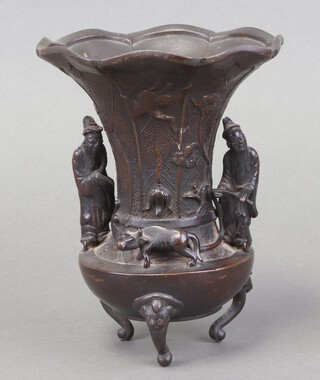 A 19th Century Japanese bronze flower head urn decorated a stork supported by 2 figures and an Oxon, raised on cabriole supports 17cm h x 30cm diam. 