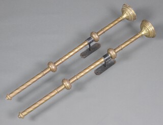 A pair of 19th Century ecclesiastical brass and iron wall mounting candle sticks 107cm h x 14cm w 