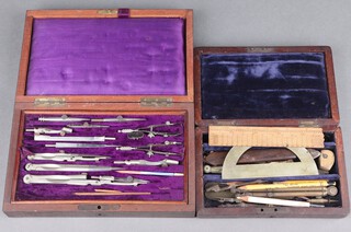 A 19th Century steel geometry set contained in an inlaid rosewood box (sections of veneer missing) and 1 other contained in a mahogany box