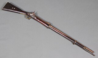 A Victorian .577 calibre Enfield 2-band carbine, lock plate stamped TOWER 1858 and crowned VR, the 33 inch barrel with proof marks and elevating ladder sight, walnut stock with brass fittings (missing timber to forearm) with possibly later steel ramrod.