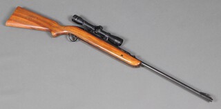 A BSA .22 Airsporter air rifle with golden antler telescopic sight 