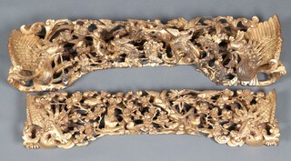 Two Chinese carved and pierced gilt painted panels depicting birds amidst branches 23cm x 89cm x 22cm and 80cm x 17cm x 6cm 
