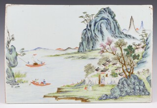A famille rose rectangular plaque, Late Qing/Republican period painted with a scene of sampans on a river, with a retreat in a mountainous landscape, 26cm x 39cm
