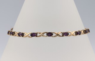 A 9ct yellow gold amethyst line bracelet 18cm, 5 grams