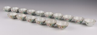 Two sets of famille rose cups, late Qing dynasty, comprising a set of ten cups painted with lotus and other flowers and a set of six cups painted with butterflies, shou characters and flowers, 4cm h and 7cm diameter respectively (16)