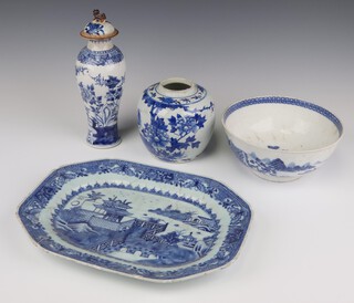 An 18th Century Chinese octagonal meat plate with landscape view (riveted and chipped), a blue and white oviform vase and cover decorated with peony with a later lid 24cm (restored lip), a blue and white ginger jar decorated with birds and flowers 14cm (no lid) and a blue and white bowl decorated with an extensive landscape (crack to base) 20cm 