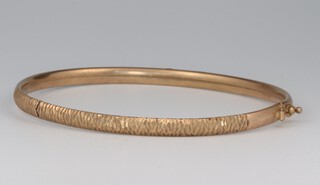 A 9ct yellow gold engraved bangle 4.7 grams 