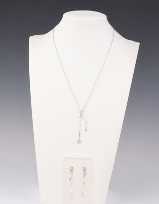 An 18ct white gold contemporary diamond necklace with drop pendant 38cm and ensuite ear studs, the diamonds in the necklace 0.25ct, the earring 0.10ct, 6.8 grams