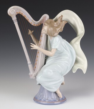 A Lladro figure of The Harpist no.6312, dated 30/10/97, signed  34cm 