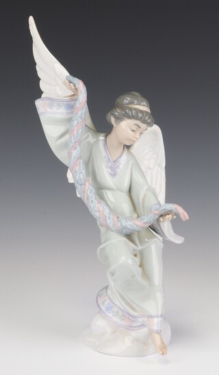 A Lladro figure "Angel with Garlands" no. 6133 dated 15 5 95, 36cm, a ditto "Angel of Peace" 6131 30cm (broken finger)