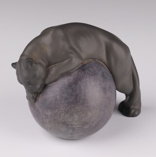 A Lladro figure "Black Panther" on a ball designed by Juan Ignacio Aliena dated 05, 10cm 