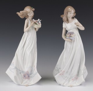 A Lladro figure "Treasures of the Earth", a young girl collecting flowers no. 6921 32cm and a ditto "Butterfly Treasures" 6777 32cm 