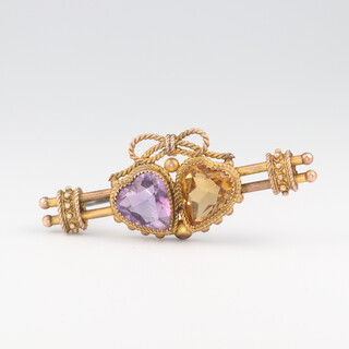 An Edwardian 9ct yellow gold double heart brooch set with a citrine and amethyst 40mm, 4.1 grams 