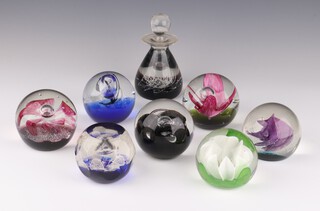 Seven Caithness paperweights - Vogue 8cm, Black Gem 696/1000 7cm, Chantilly 462/500 7cm, Scotland 172/350 7cm, Dream Flower 289/750 7cm, Crusader 510/750 7cm, Flower Form 131/1500 7cm and a ditto bottle Sea Grass 12cm (no boxes) 