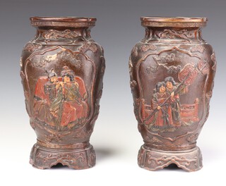 A pair of 1930's Japanese ceramic vases decorated with panels of birds and figures 30cm 