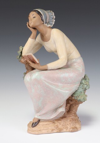 A Lladro Gres figure of a lady leaning on a tree reading a book 34cm, a ditto "Island Beauty" 2382 17cm (chip to flower)