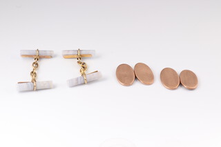 A pair of 9ct yellow gold engine turned cufflinks 2.6 grams and a pair of lace agate gold mounted ditto