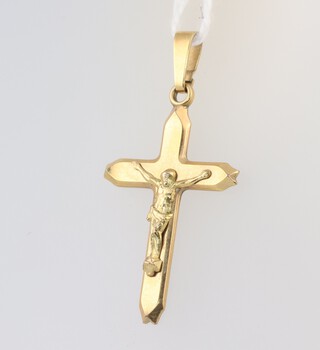 A 14ct yellow gold crucifix 1.8 grams 