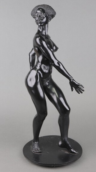 Ronald Cameron (British, 1930-2013), a black patinated cast metal study of a standing female nude on a circular base, signed "R. Cameron" and  editioned 4/8, 55cm. 